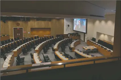  ?? (AP/Mary Altaffer) ?? Lebanese President Michel Naim Aoun is seen on a video screen Wednesday in an empty conference room remotely addressing the 75th session of the United Nations General Assembly at U.N. headquarte­rs.