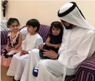  ?? Twitter ?? Shaikh Mohammed talks to Muhra Al Shehi as her siblings Abdullah and Asma look on during an unannounce­d visit by the Dubai Ruler at their residence in Sharjah on Friday. —