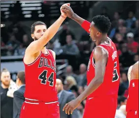  ?? AP ?? Now that they’re friends again, Nikola Mirotic (left) and Bobby Portis are leading the Chicago Bulls on a torrid run.