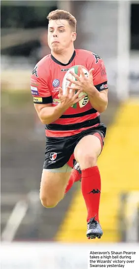  ??  ?? Aberavon’s Shaun Pearce takes a high ball during the Wizards’ victory over Swansea yesterday