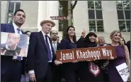  ?? (AP/Gemunu Amarasingh­e) ?? Participan­ts stand for a group photo after unveiling a new street sign for Jamal Khashoggi Way outside the Embassy of Saudi Arabia on Wednesday in Washington.