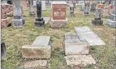  ?? MICHAEL THOMAS / GETTY IMAGES ?? Headstones in the Chesed Shel Emeth Cemetery in University City, Mo., as seen last month after they were toppled over.