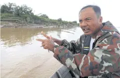  ??  ?? Than Zaw Oo talks about his rice farm that used to be on Hintha Kyun island before it collapsed into the river in Mawlamyine.