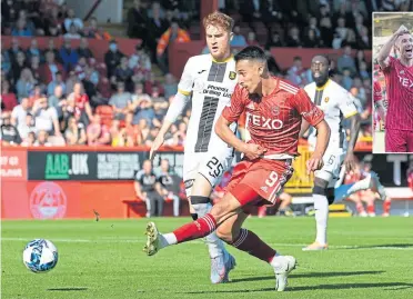  ?? ?? Bojan Miovski scores for the Dons to make it 4-0 against Livingston