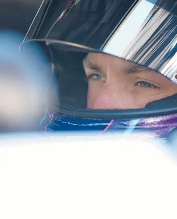  ?? JARED C. TILTON/GETTY ?? Denny Hamlin sits in his car during qualifying for the Toyota Owners 400 on Satuday.