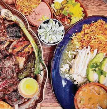  ?? Greg Morago / Staff ?? The mixed parrillada platter at Goode Co. Kitchen & Cantina in the Heights stole the show, thanks to the mesquite-grilled beef filet, chicken fajitas, carnitas and Texas quail.