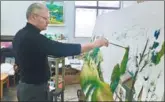  ??  ?? Vladimir Ganin paints in his studio at the Hunan Institute of Science and Technology.