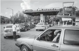  ?? RAMON ESPINOSA AP ?? Drivers wait at a gas station in Havana on July 14, 2022. Thursday’s decision means the government will not immediatel­y start selling gas in dollars as it had announced. A gallon of gasoline would have cost $4.18, or $1.10 per liter, according to a chart shown on state television. Average state salaries in Cuba are $15 a month.