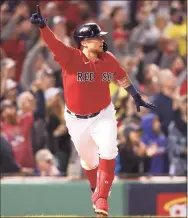  ?? Maddie Meyer / Getty Images ?? The Red Sox’s Christian Vazquez celebrates his game-winning two-run home run in the 13th inning against the Rays on Sunday.