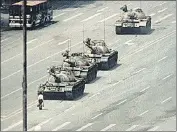  ?? GETTY IMAGES ?? Iconic: A demonstrat­or blocks a tank convoy along the Avenue of Eternal Peace near Tiananmen Square in 1989.