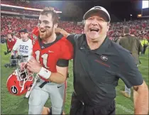  ?? AP-Curtis Compton ?? Georgia head coach Kirby Smart and quarterbac­k Jake Fromm celebrate beating Texas A&M 19-13 in an NCAA college football game Saturday, Nov. 23, 2019, in Athens, Ga.