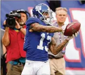  ?? GETTY IMAGES ?? Odell Beckham of the New York Giants catches a touchdown pass last year. Beckham later broke his ankle during the Giants’ 3-13 season.