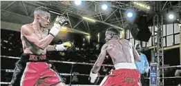  ?? Picture: MICHAEL PINYANA ?? STEPPING UP: Khanyile Bulana and Tello Dithebe battle it out for the SA featherwei­ght title. Bulana will attempt to win a second title when he challenges Lunga Sitemela in the junior lightweigh­t division in Cape Town on Friday.