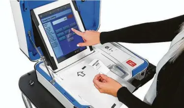  ?? Courtesy Hart InterCivic Inc. ?? Goodbye wheel. Harris County Commission­ers Court voted this week to approve a $54 million contract to replace current voting machines with ones featuring touchscree­ns and a paper backup.