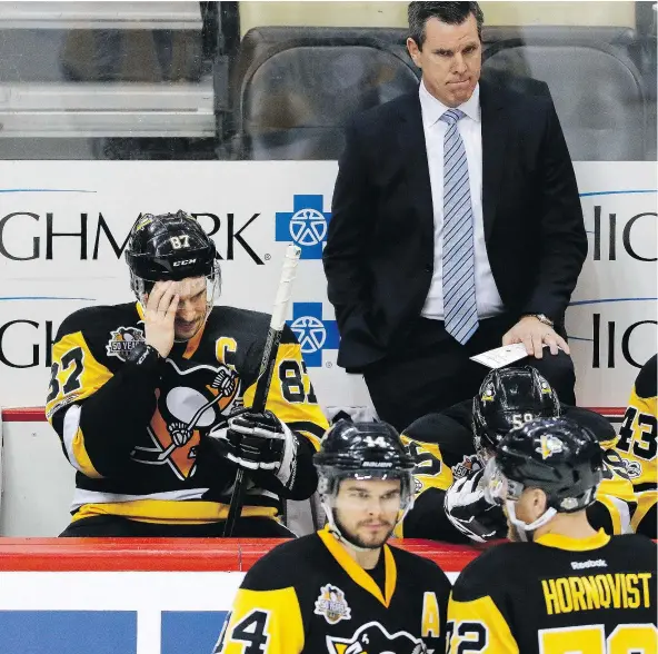  ?? — AP FILES ?? Sidney Crosby and Penguins coach Mike Sullivan were tight-lipped after being asked about Crosby’s headfirst collision into the boards Monday in Washington. Crosby, who suffered a concussion May 1, didn’t leave the bench immediatel­y after for an...
