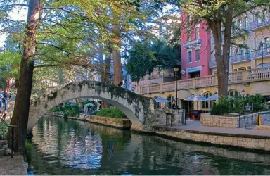  ??  ?? ABOVE AND BELOW: San Antonio’s world-renowned urban waterway is lined with restaurant­s, shops and hotels. BOTTOM: San Antonio—the Saga is a fascinatin­g sound and light show at the San Fernando Cathedral.