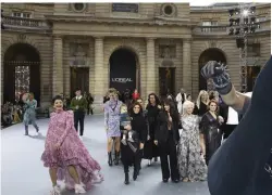  ??  ?? Aishwarya Rai (from left), Eva Longoria, Camila Cabello, Dame Helen Mirren, Geri Horner, Amber Heard and Doutzen Kroes wear creations as part of the L’Oreal collection in Paris on Saturday.