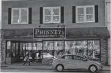  ?? CAROLE MORRIS-UNDERHILL ?? Although sporting a modernized exterior, Phinneys, as pictured in 2022, is as recognizab­le today as it was a century ago.