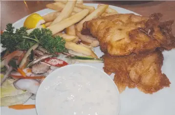  ?? Pictures: SUPPLIED ?? Barra and chips at the 19th Hole Restaurant