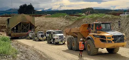  ?? PHOTO: RACHAEL KELLY/STUFF ?? It took five trucks to pull Waikaia Gold’s plant out of the mine pond in Southland.