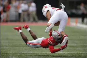  ?? JAY LAPRETE — THE ASSOCIATED PRESS ?? Ohio State defensive back Jeff Okudah tackles Florida Atlantic tight end Harrison Bryant during the first halfAug. 31 in Columbus.