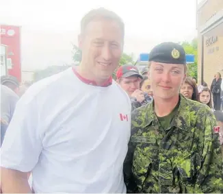  ??  ?? Defence Minister Peter MacKay joined Cpl. Kate MacEachern for the final kilometre of last year’s walk.