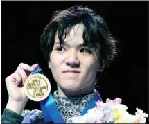  ?? ?? Shoma Uno of Japan shows off his gold medal after winning the men’s free skating in the World Figure Skating Championsh­ips in Saitama, north of Tokyo . (AP )