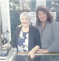  ??  ?? Mary Brain behind the counter with her daughter Denise Hooley