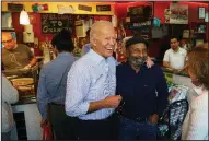  ?? AP/The Philadelph­ia Inquirer/JESSICA GRIFFIN ?? Former Vice President Joe Biden greets customers at Gianni’s Pizza in Wilmington, Del., on Thursday after announcing his bid for the Democratic presidenti­al nomination.