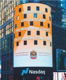  ?? ?? The Nasdaq MarketSite in Times Square, New York flashes the news of the listing of the UAE bonds.