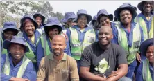  ?? PICTURE: COLLEEN DARDAGAN ?? Bonginkosi Maphumulo and Thabani Hadebe surrounded by the some of the 31 people hired by Enviroserv to eradicate alien species at their premises at Shongweni. The pretty but fast-spreading water hyacinth, right, is just one of Durban’s top plant...