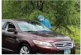  ??  ?? McKinley United Methodist Church and Primary Health Solutions held a testing.
Cars line up for COVID-19 testing on May 5, at Fort Hamilton Hospital in Hamilton.