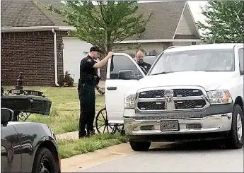  ?? TIMES photograph by Annette Beard ?? Police took Ben Caston, 59, in a police vehicle and to the Pea Ridge Police station for questionin­g as part after a shooting of a 28-year-old man at 1072 Richards St. The incident is still under investigat­ion, according to Lt. Michael Lisenbee, public informatio­n officer.