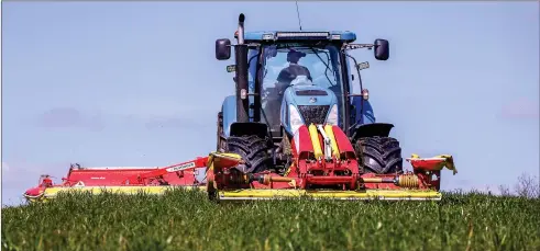  ?? ?? Above: Nathan Thompson, Agri, cutting first cut silage at the farm of Alan Burleigh, Lisnaskea this week.