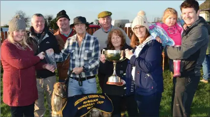  ?? Photo by David O’Sullivan ?? Mary and Jermiah Dennehy receiving the cup from David Power and the Horgan family, sponsor of the cup, after Jermiah’s dog, Cuine Edge, won the Derby Trial Stakes at Lixnaw coursing last Sunday.