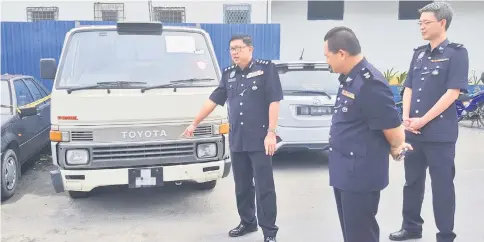  ??  ?? Lim points at the lorry, which was reported missing in Pujut on Dec 24 but was later recovered by his men.