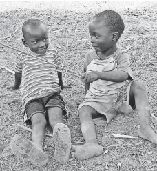  ?? TONNY ONYULO FOR USA TODAY ?? Children such as these playing in Nakasongol­a, Uganda, live in constant fear of being kidnapped and ritually sacrificed.