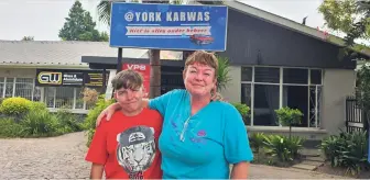  ?? Photo: Alida de Beer George Herald ?? Samantha’s hands were black from applying tyre treatment when visited the car wash where she and her mother, Jenni have been appointed, but she didn’t seem to mind, because she has a job.