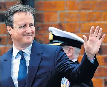  ??  ?? David Cameron, the Prime Minister, manages a smile during Armed Forces Day in Cleethorpe­s yesterday, while Boris Johnson looks triumphant as he leaves home