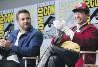  ?? RICHARD SHOTWELL/THE ASSOCIATED PRESS ?? Ben Affleck, left, seen with Ezra Miller during a Comic-Con panel over the weekend, says he will play Batman in an upcoming film.