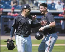  ?? AP photo ?? Yankees starting pitcher Nestor Cortes (left) and Twins third baseman Jose Miranda share a laugh during the first inning of a spring training game Monday.