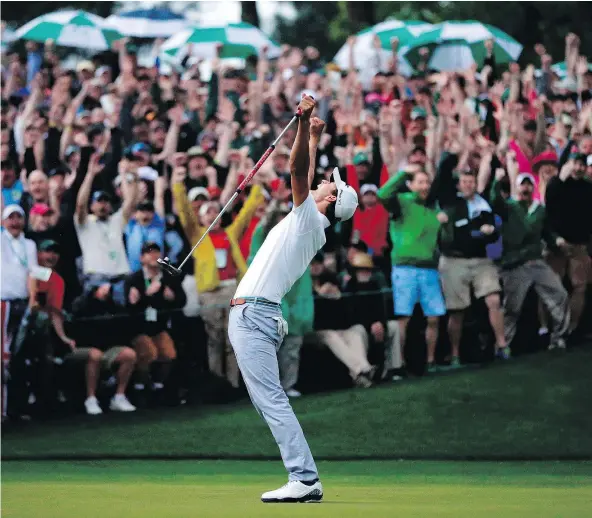  ?? — THE ASSOCIATED PRESS FILES ?? Adam Scott, of Australia, made a birdie putt on the second playoff hole to win the 2013 Masters. It was a moment of redemption for Scott, who lost the British Open in agonizing fashion the previous year, bogeying the last four holes.