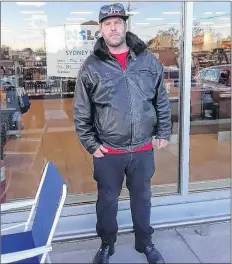  ?? CP PHOTO ?? Canadian fiddler Ashley MacIsaac lines up for the opening of a cannabis store in Sydney River, N.S., Wednesday as cannabis became legal in Canada.