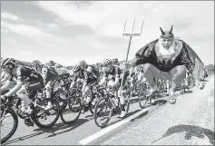  ??  ?? German supporter Didi Senft known as El Diablo jumping as the pack riding during the seventh stage of the Tour de France. — AFP photo