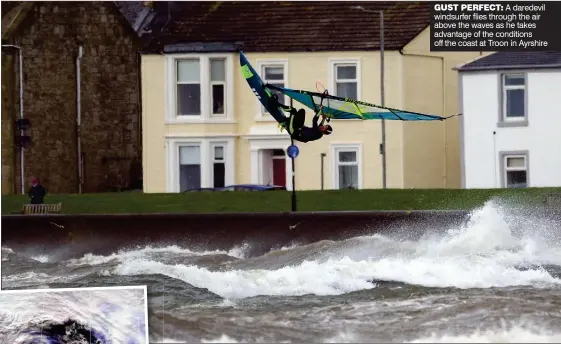  ?? ?? GUST PERFECT: A daredevil windsurfer flies through the air above the waves as he takes advantage of the conditions off the coast at Troon in Ayrshire