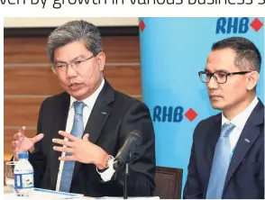  ??  ?? Sharing insights: Khairussal­eh (left) and RHB Banking Group chief financial officer Syed Ahmad Taufik Albar at the briefing.