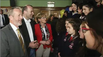  ??  ?? Sean Kelly MEP, Manfred Werber MEP, chairman of the European People’s Party, and Mairead McGuinness MEP chatting to students from St Mary’s College’s European Studies and Politics & Society classes during their visit to the school.