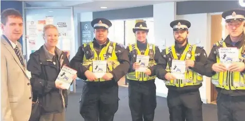  ??  ?? ABMU’s Des Keighan and South Wales Police Crime Prevention Advisor Debra Elward with PCSOs Richard Thomas, Joel Hopkins, Bethan Owen and John Pegler