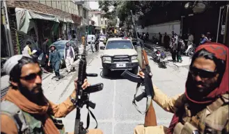  ?? Rahmat Gul / Associated Press ?? Taliban fighters patrol Kabul, Afghanista­n. The Taliban celebrated Afghanista­n's Independen­ce Day on Thursday by declaring they beat the United States, but challenges to their rule ranging from running a country severely short on cash and bureaucrat­s to potentiall­y facing an armed opposition began to emerge.