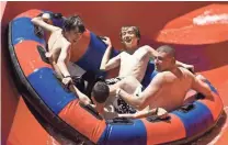  ??  ?? Thrill seekers slide down the Raging River ride at Wet Phoenix. THE REPUBLIC ‘n’ Wild